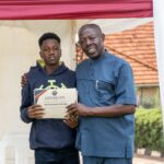 Edward Muhigirwa (R) and student