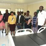 Andrew Mubangizi, in-charge of Maziba Sub-District Hospital (in a white overall)