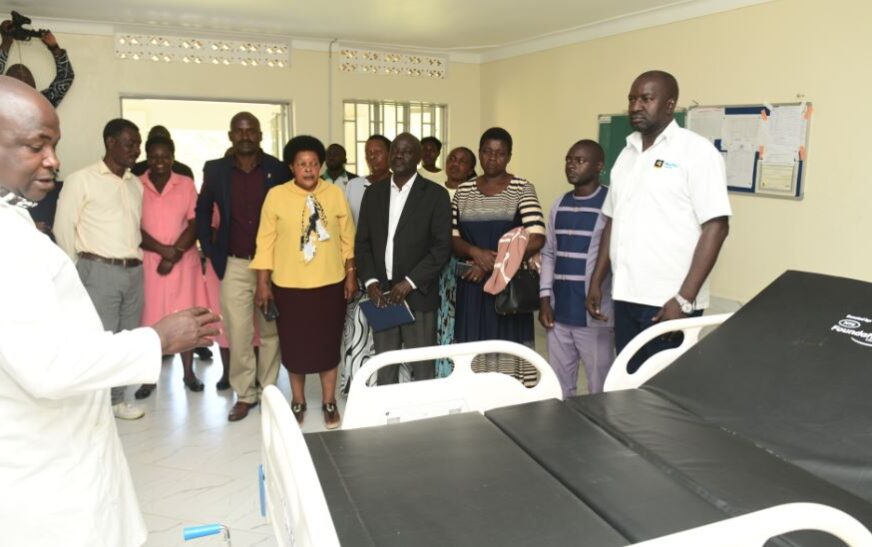 Andrew Mubangizi, in-charge of Maziba Sub-District Hospital (in a white overall)