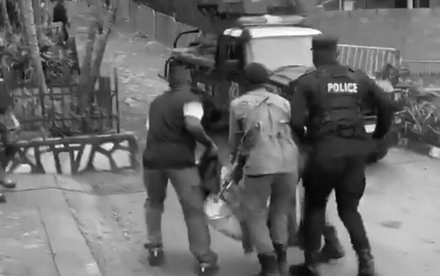 Ronald Mulwana being carried away by security officers