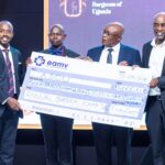 (1st left) Mr. Brian Kavuya, Managing Director of East African Medical Vitals handing over the donation of 3000 pairs of medical gloves to ASOU leadership during the fundraising dinner on 31st July at Hotel Africana, Kampala.