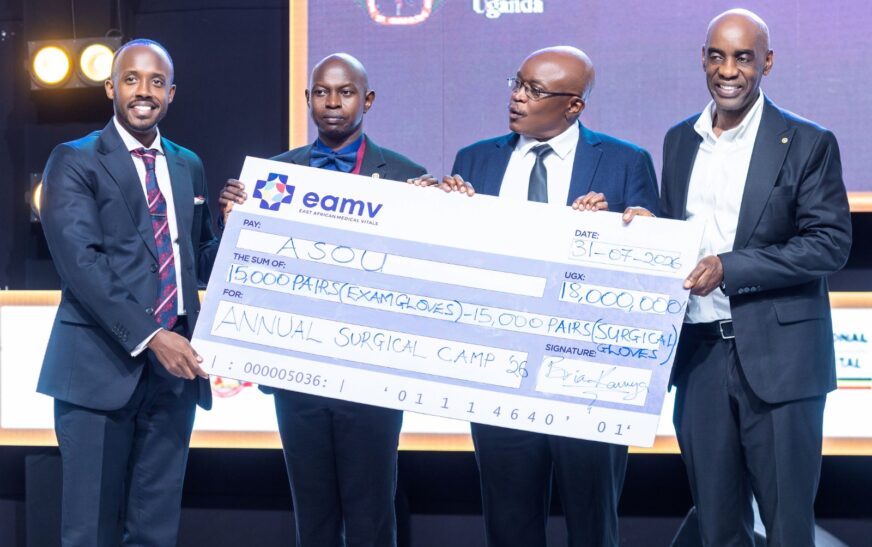 (1st left) Mr. Brian Kavuya, Managing Director of East African Medical Vitals handing over the donation of 3000 pairs of medical gloves to ASOU leadership during the fundraising dinner on 31st July at Hotel Africana, Kampala.